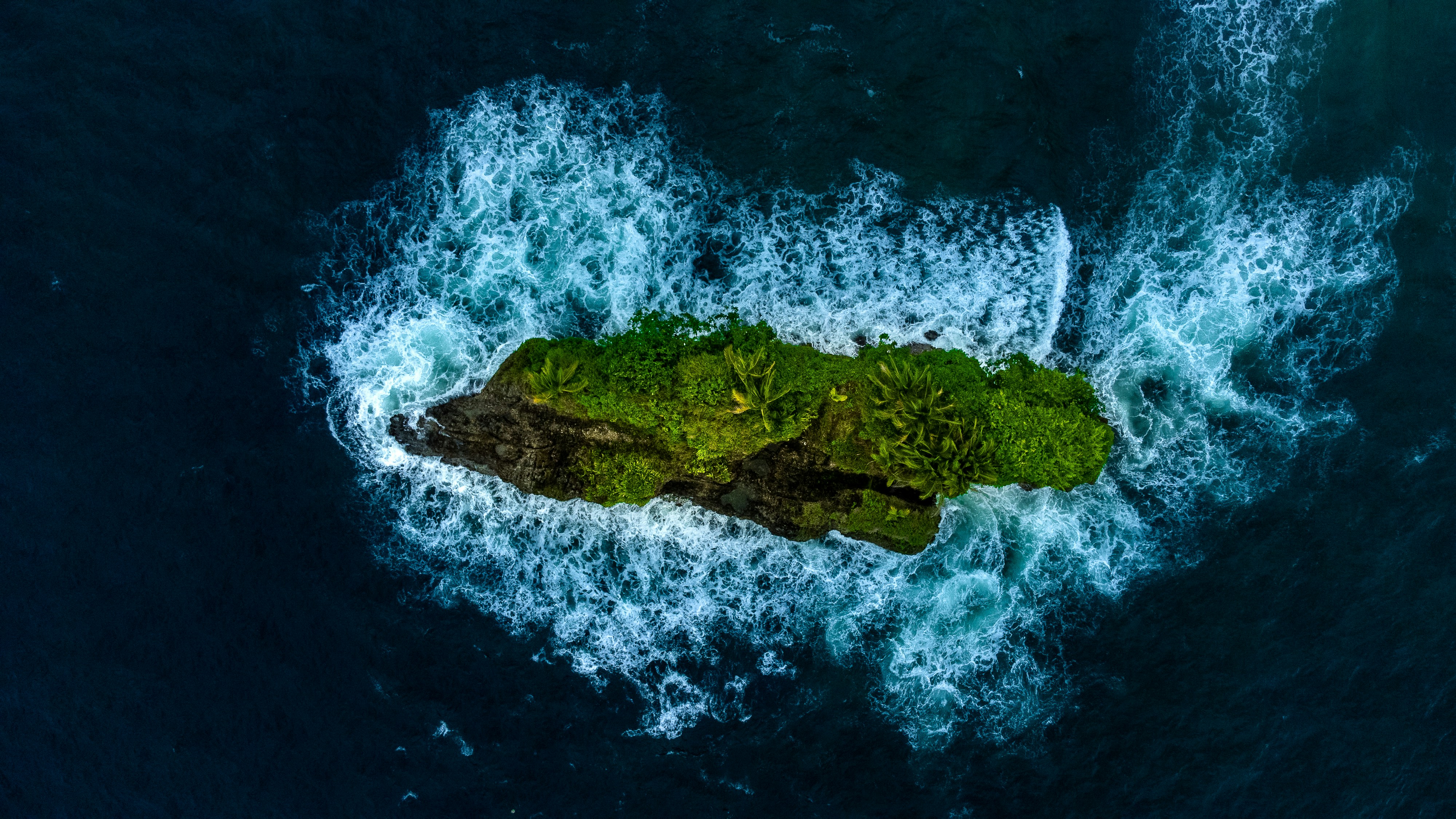 a small island in the middle of the ocean, Isolated in the azure embrace of the ocean, this lone island stands as a beacon of solitude and resilience. Surrounded by the frothy lace of the sea