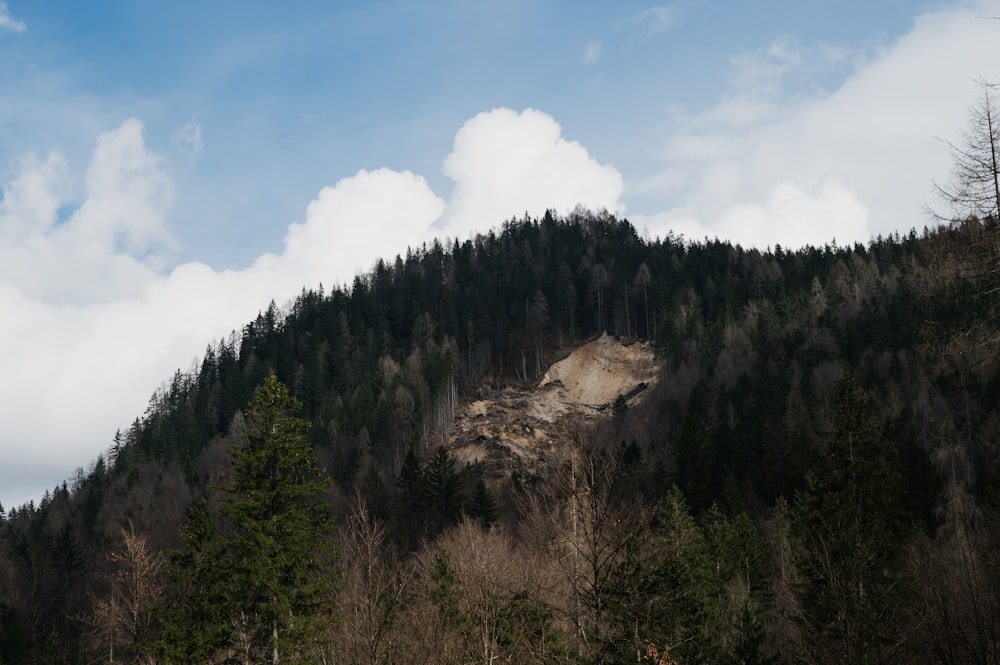 a mountain with a large mound of dirt on top of it