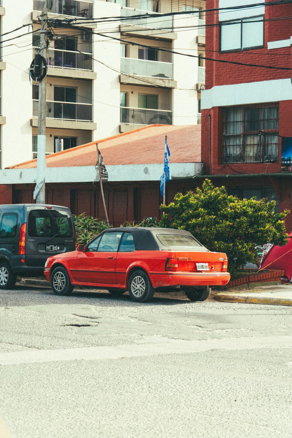 a couple of cars parked on the side of the road