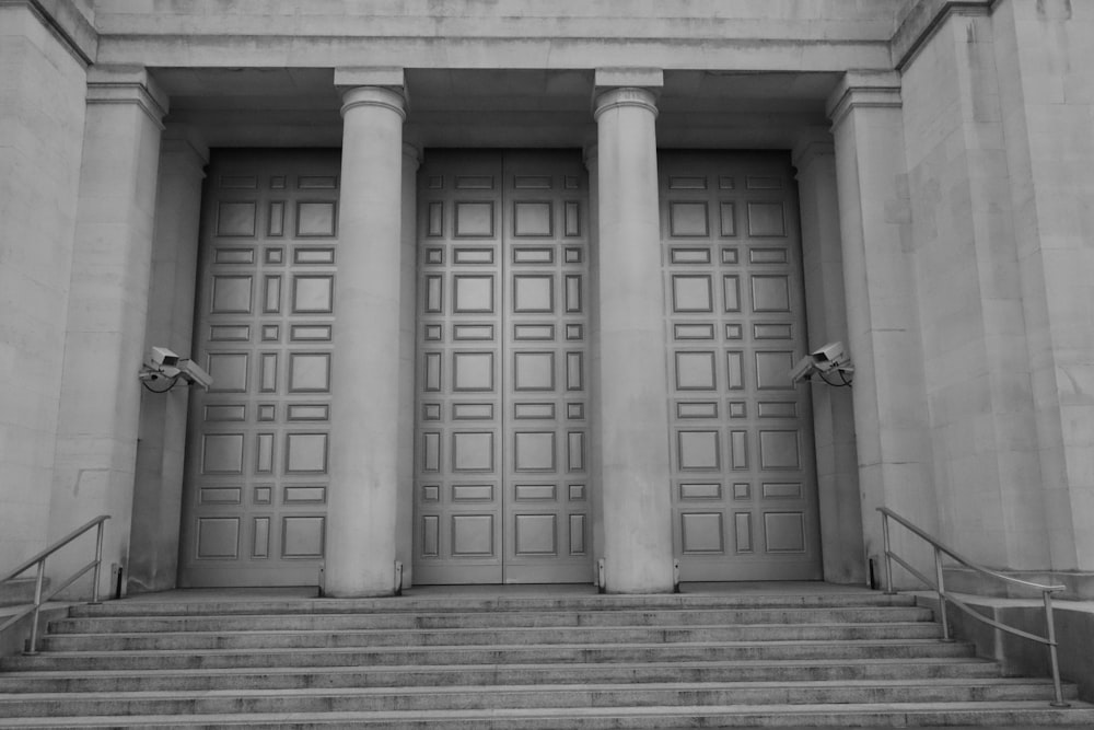 a black and white photo of steps leading to a building