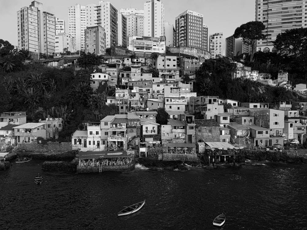 a black and white photo of a city with lots of buildings