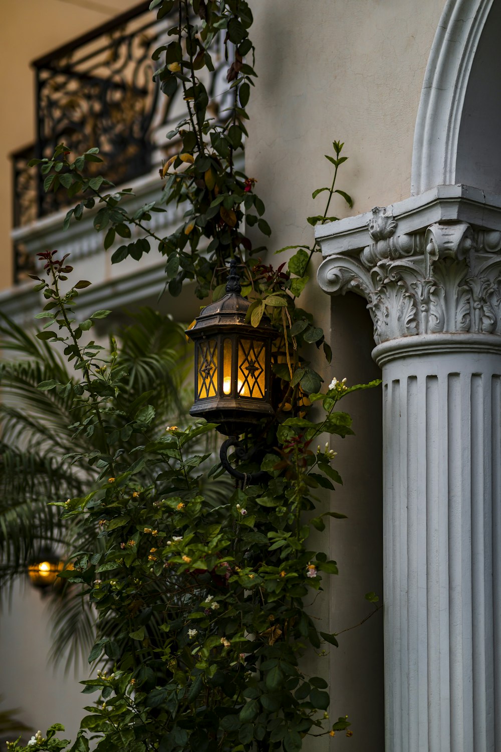 a lamp hanging from the side of a building