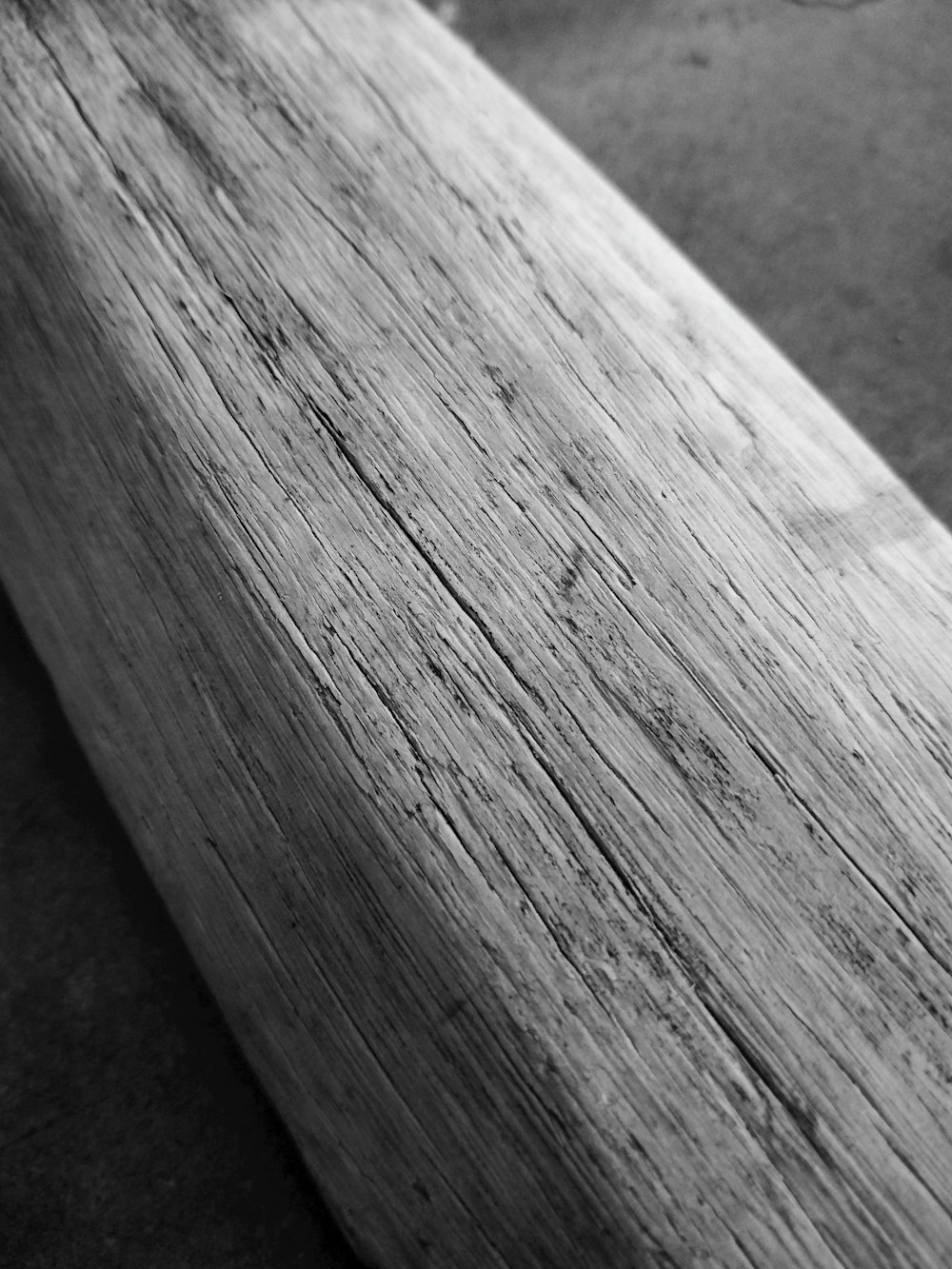 a black and white photo of a wooden bench