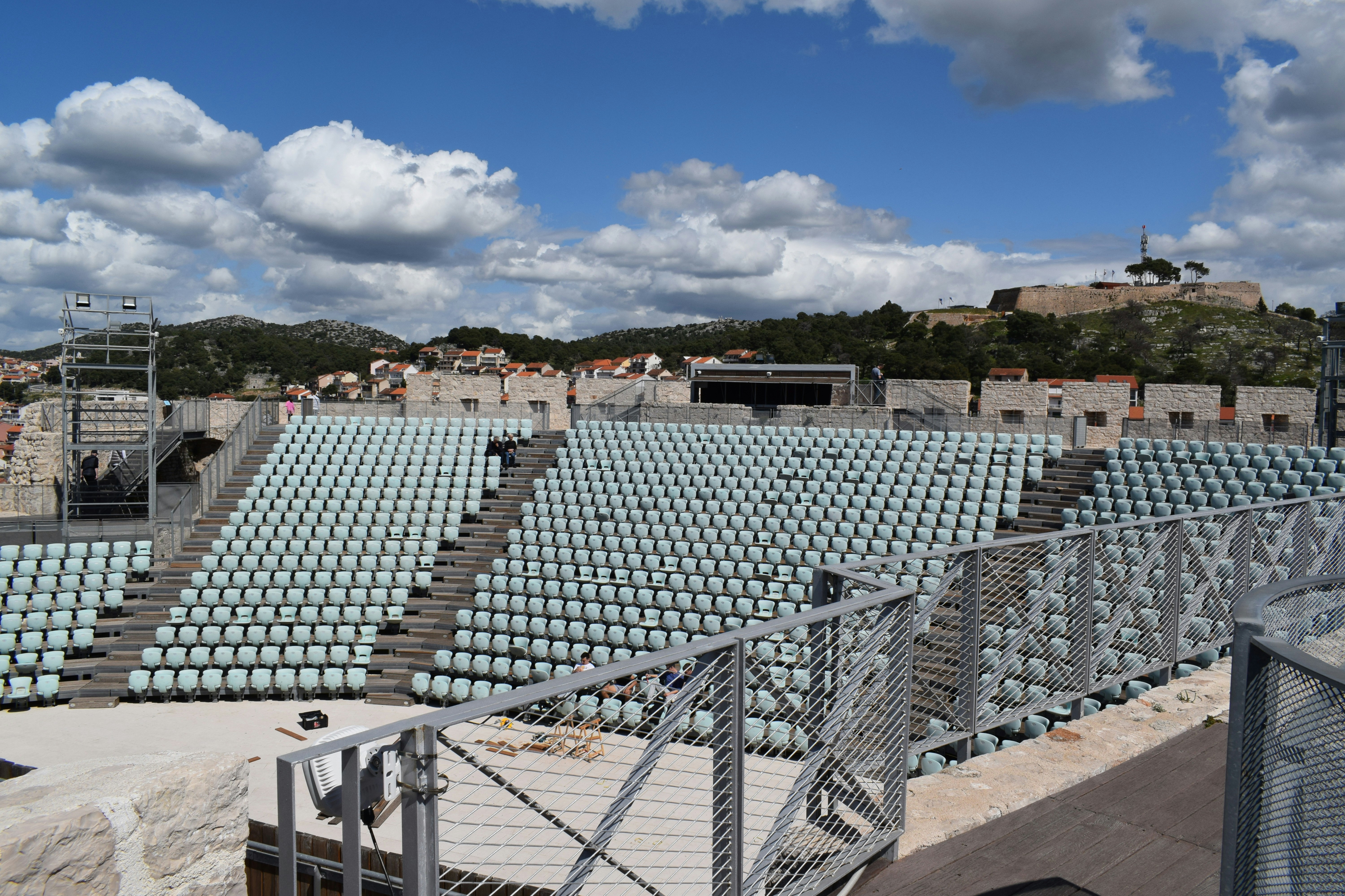 a large stadium filled with lots of empty seats, St Michael