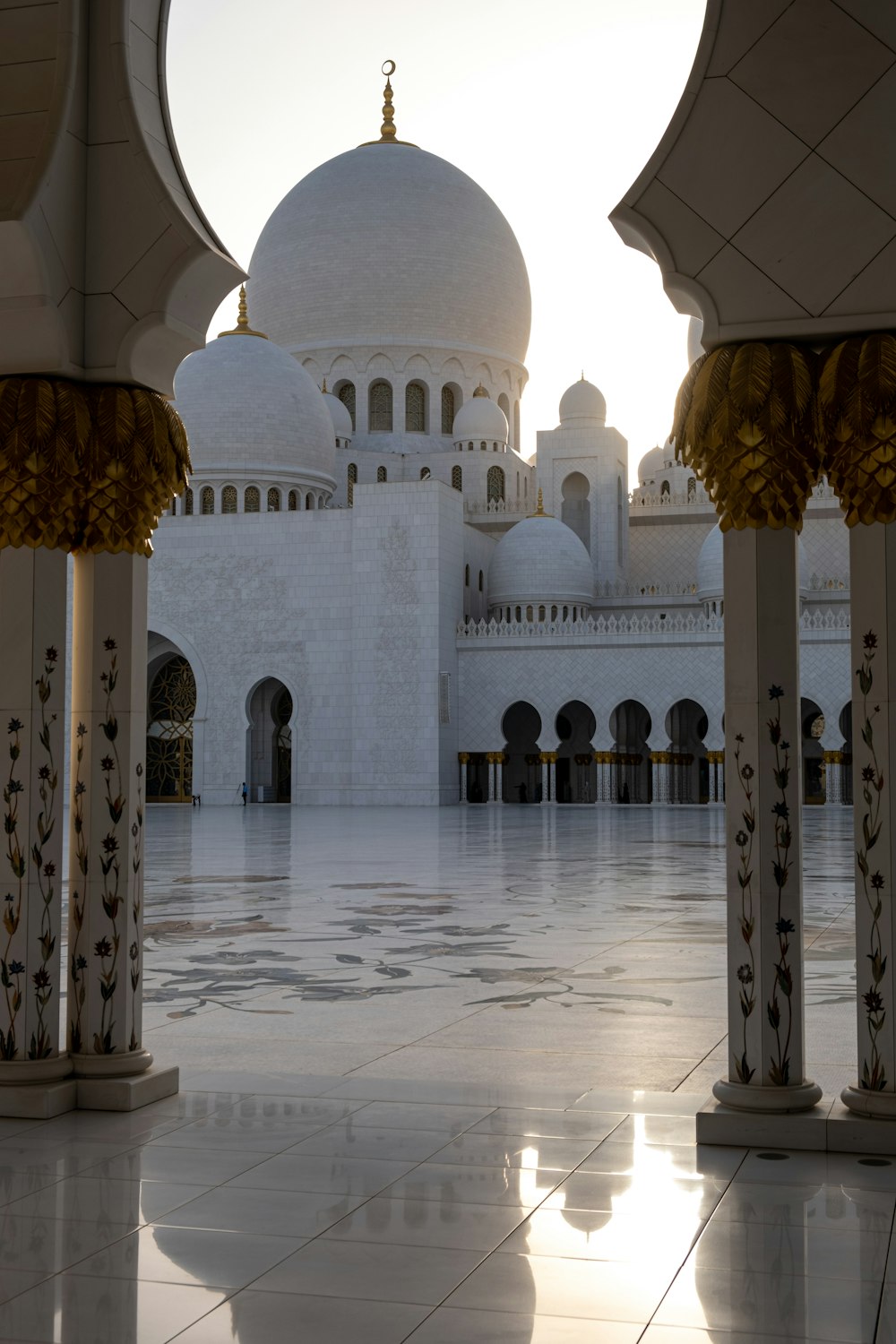 a large white building with columns and arches