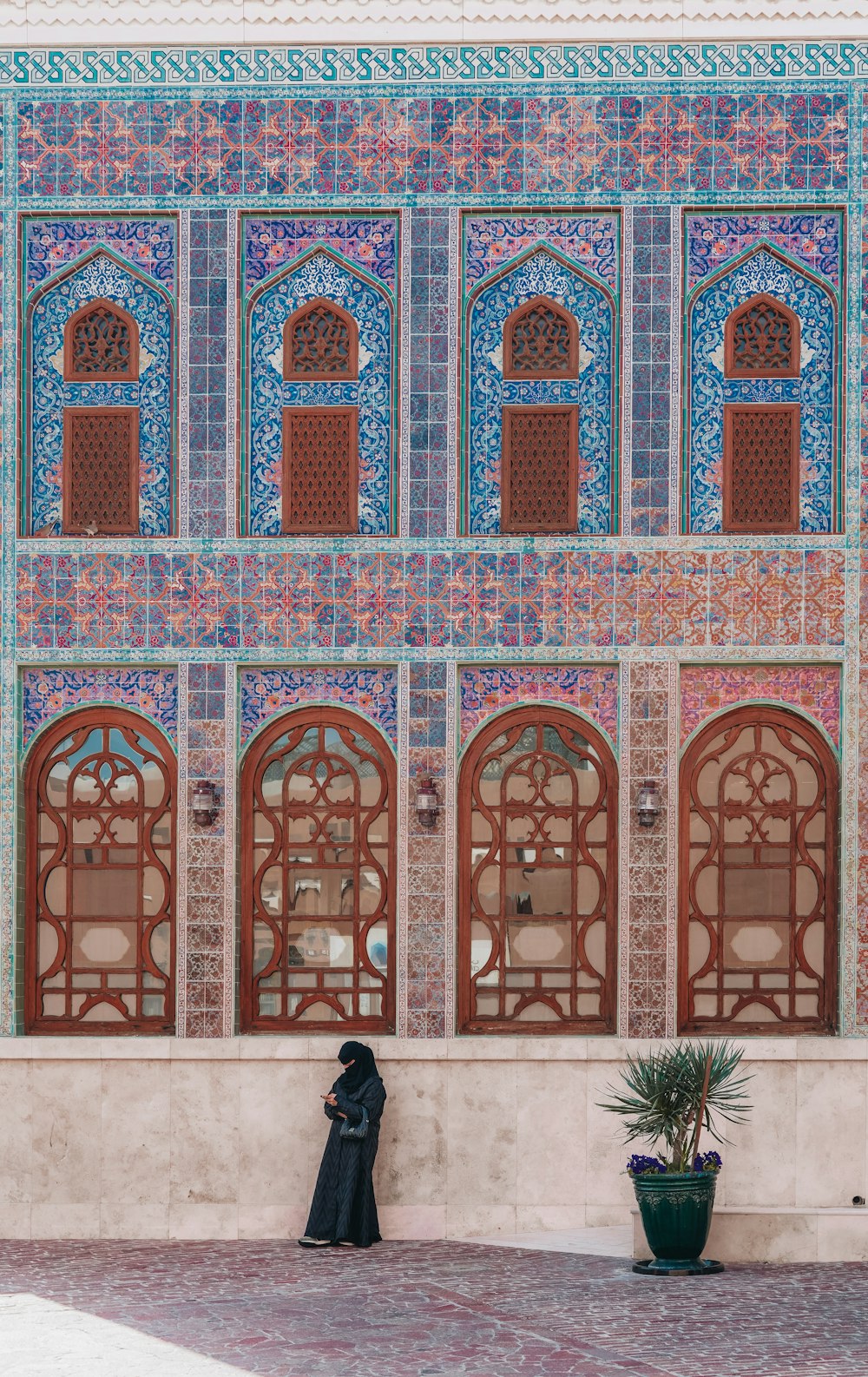 a woman standing in front of a building