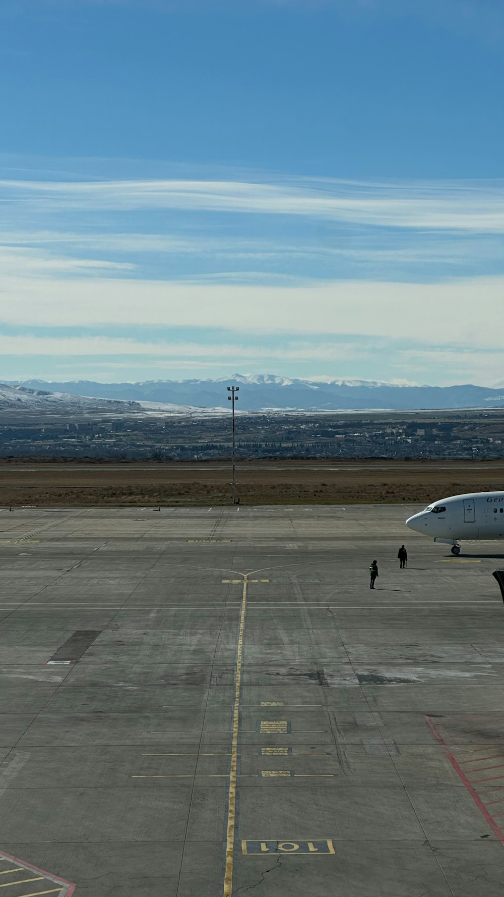 an airplane is sitting on the tarmac at an airport