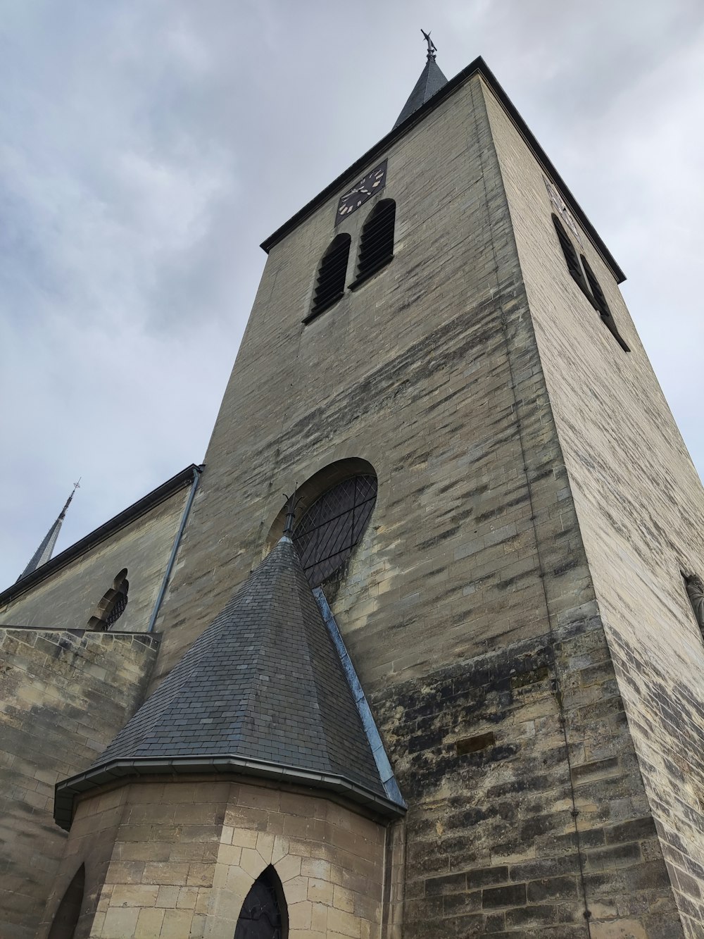 a tall tower with a clock on the top of it