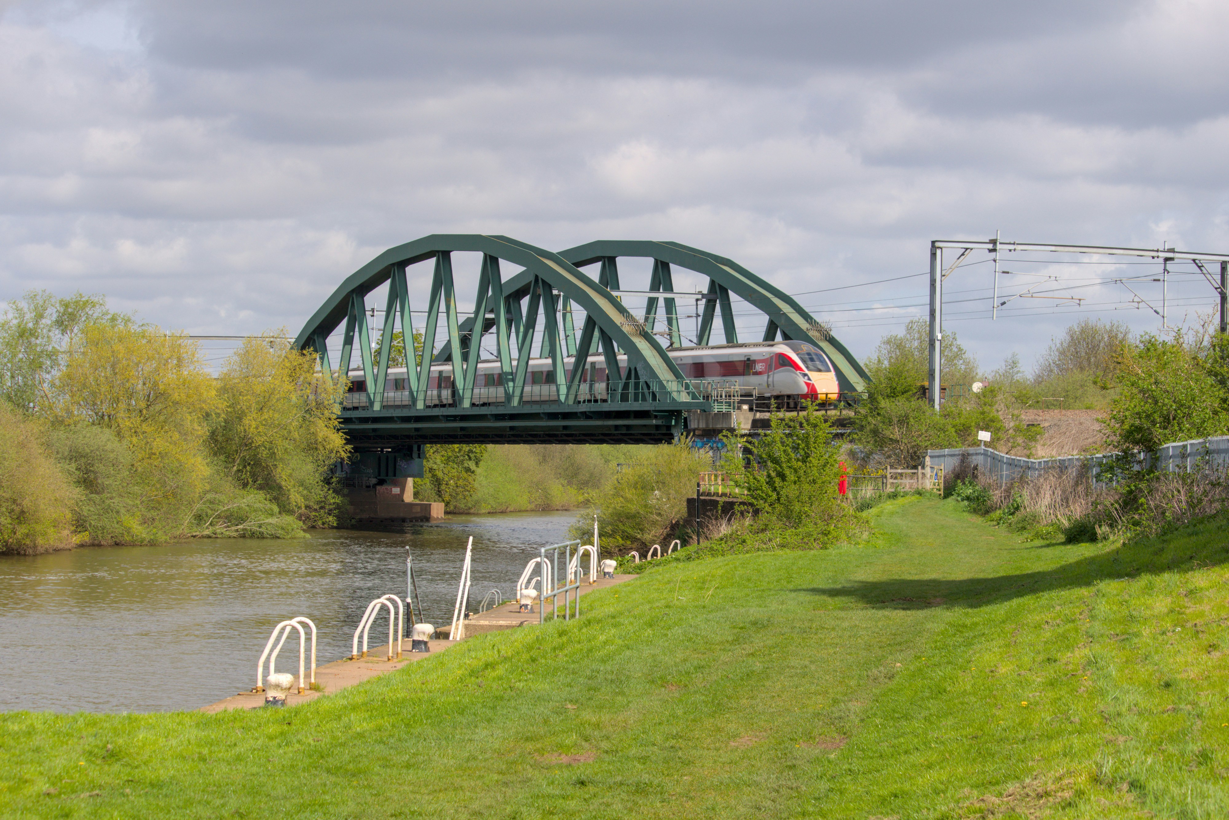 a train crossing a bridge over a river