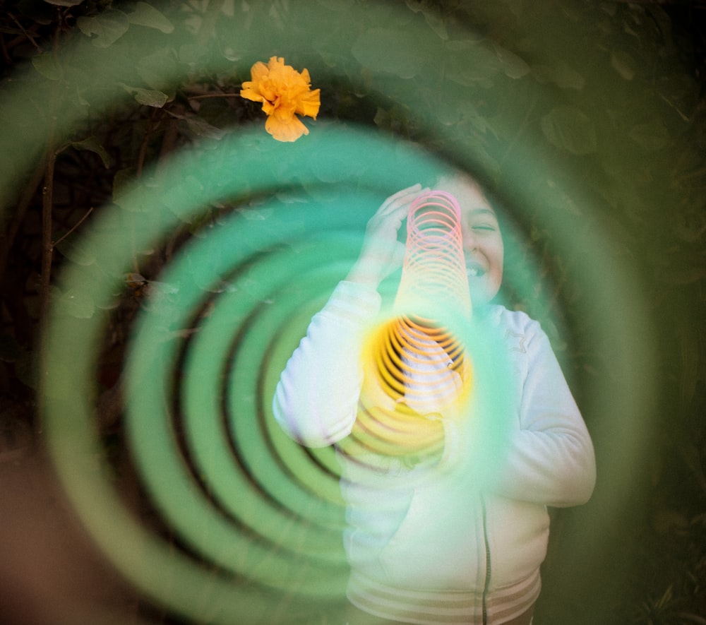 a woman holding a microphone in front of her face