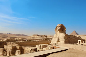 a large sphinx statue in the middle of a desert