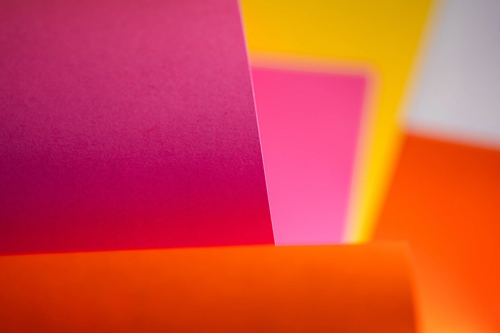 a group of different colored papers stacked on top of each other
