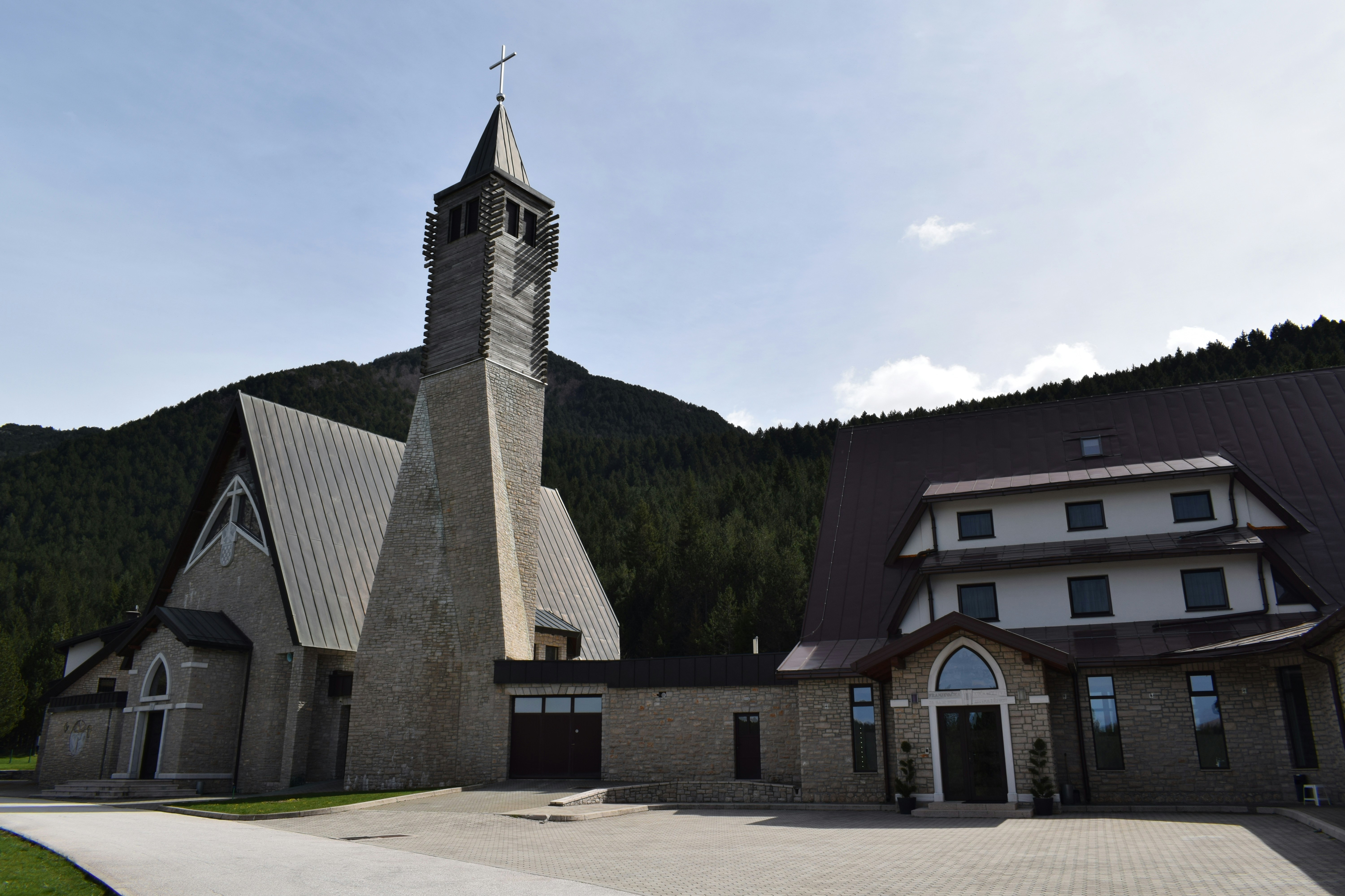 a church with a steeple and a clock tower
