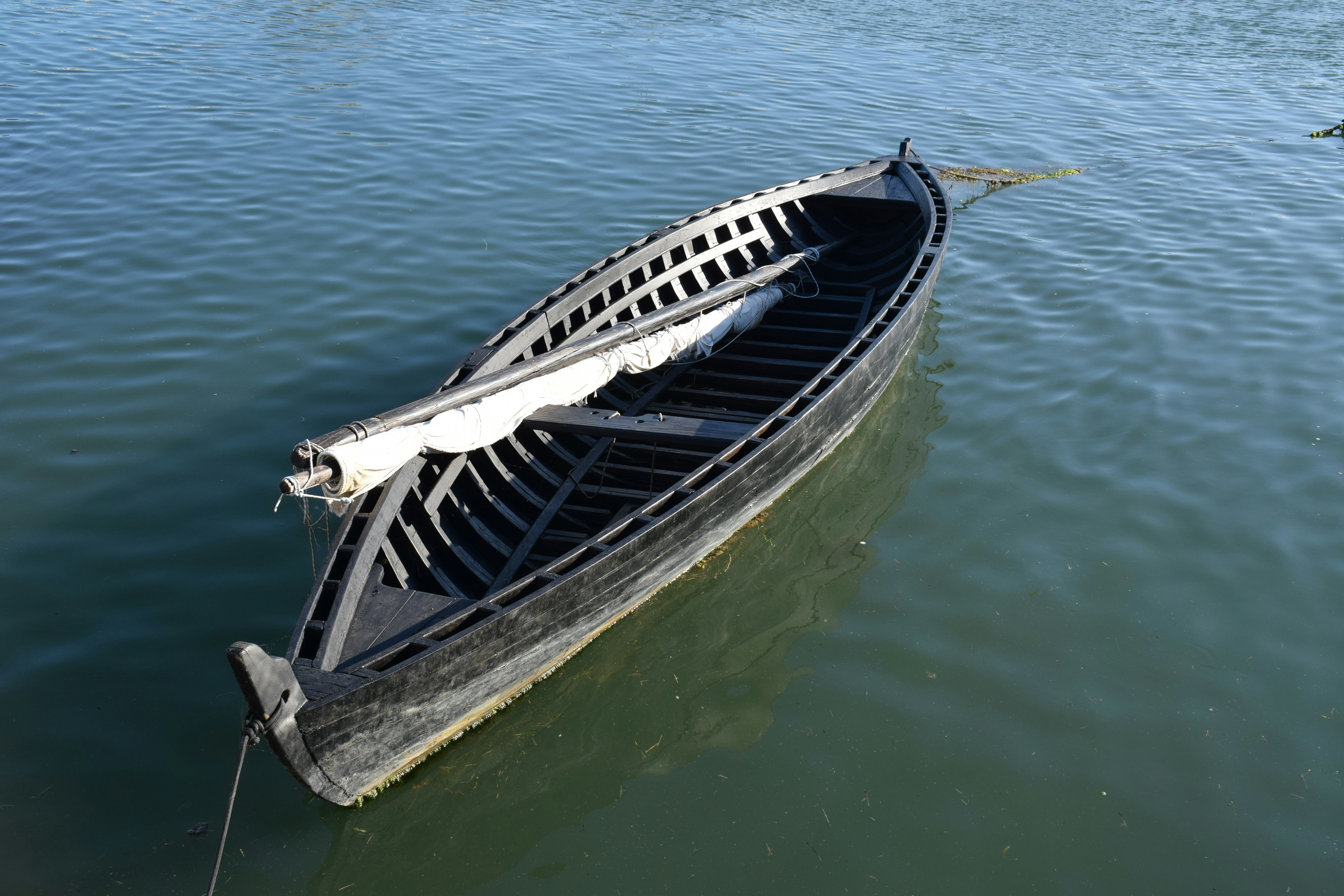 a boat sitting on top of a body of water