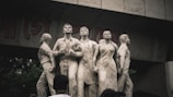 a group of statues in front of a building