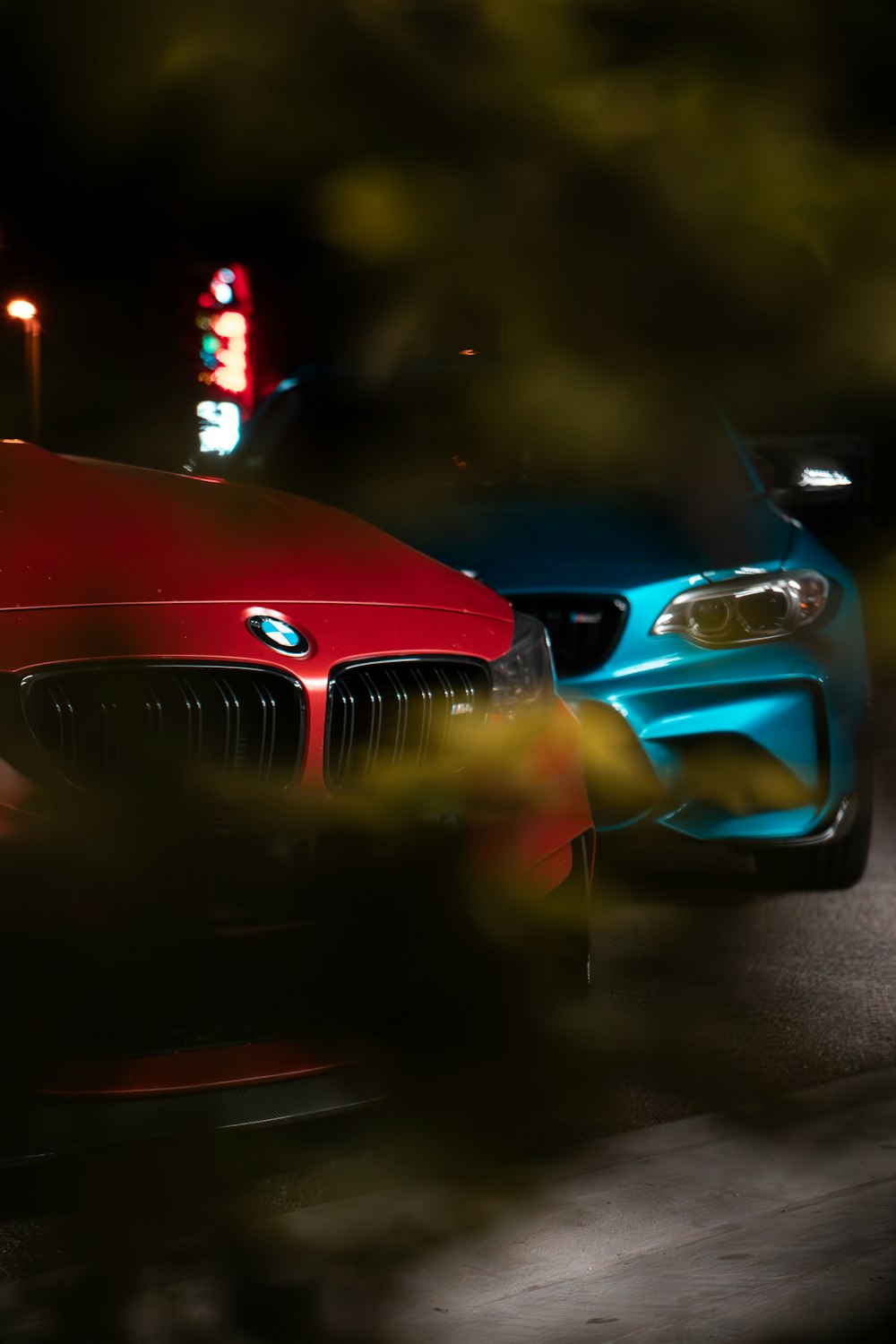 a couple of cars that are sitting in the street