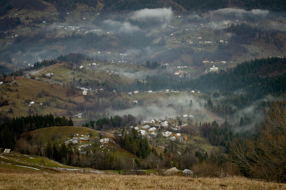 a view of a village in the mountains