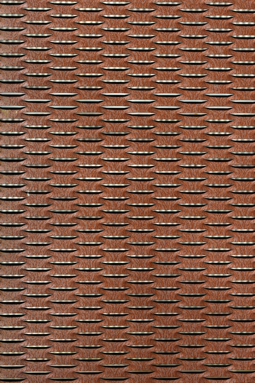 a red brick wall with a pattern on it