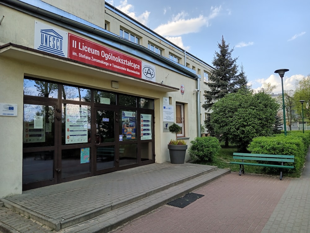 a building with a green bench in front of it