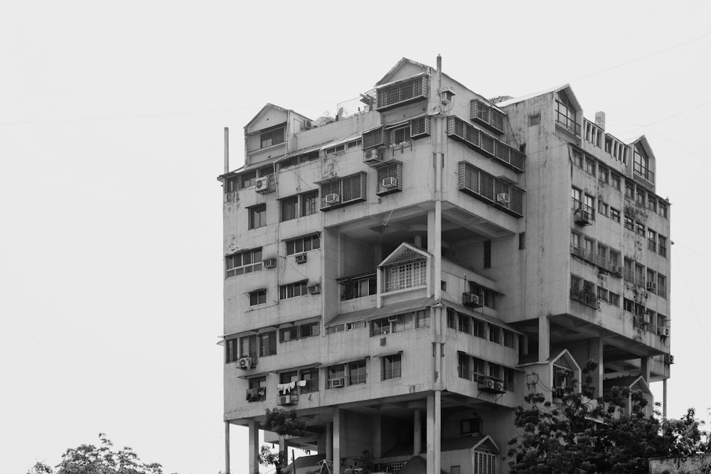 a tall building with balconies on top of it