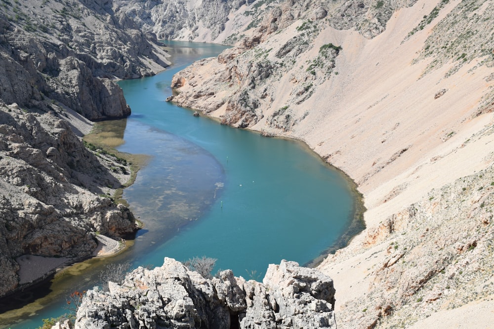 a river in a canyon surrounded by mountains