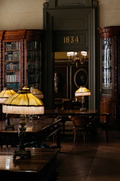 a room with a table and a lamp in it