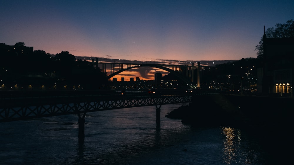 a bridge over a body of water at night