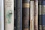 a row of books sitting on top of a shelf