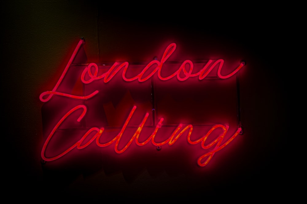 a neon sign that says london calling