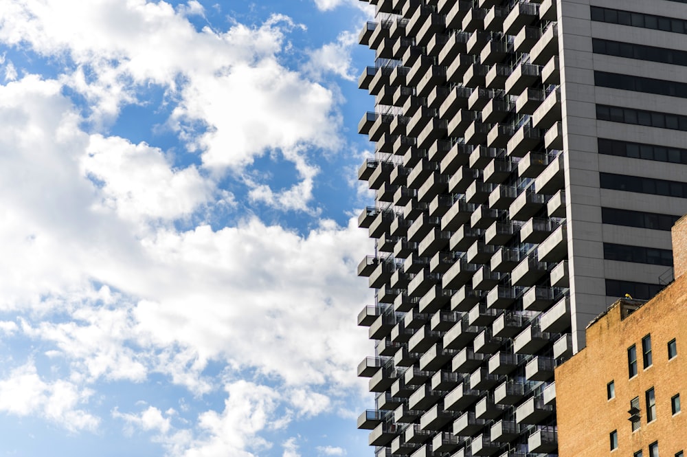 a tall building next to a very tall building