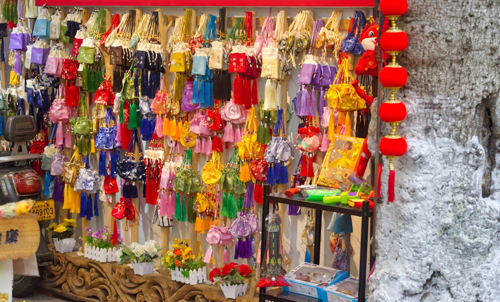 a store with a lot of colorful items hanging from it's walls
