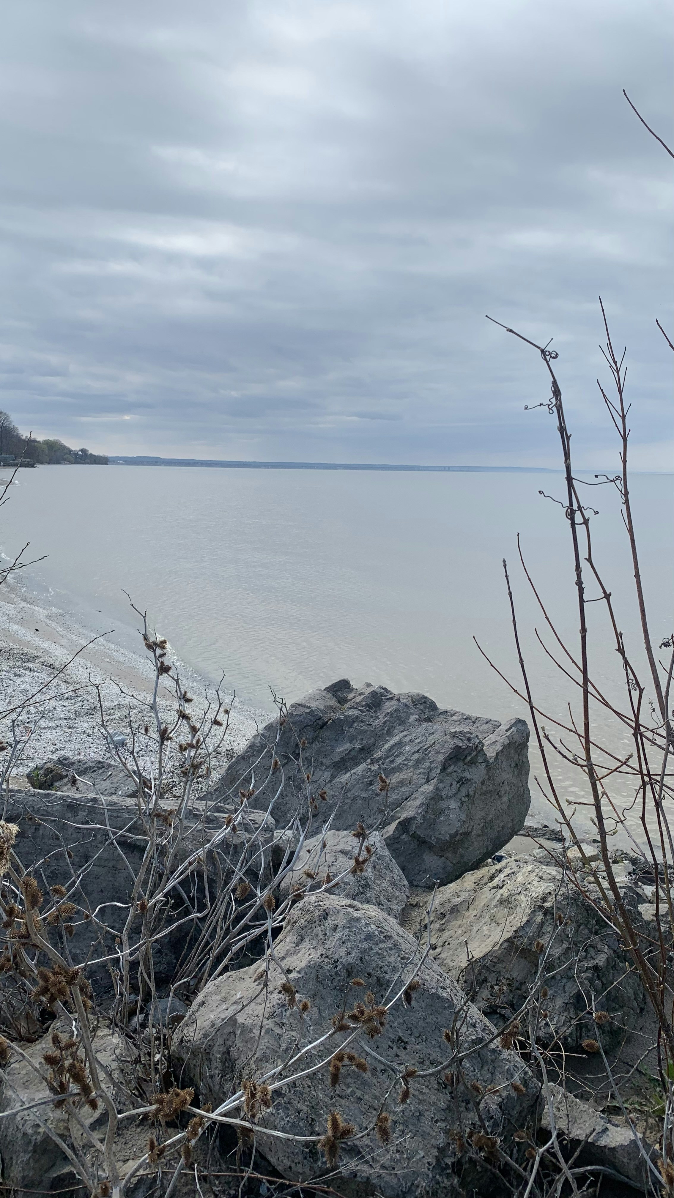 a rock outcropping next to a body of water
