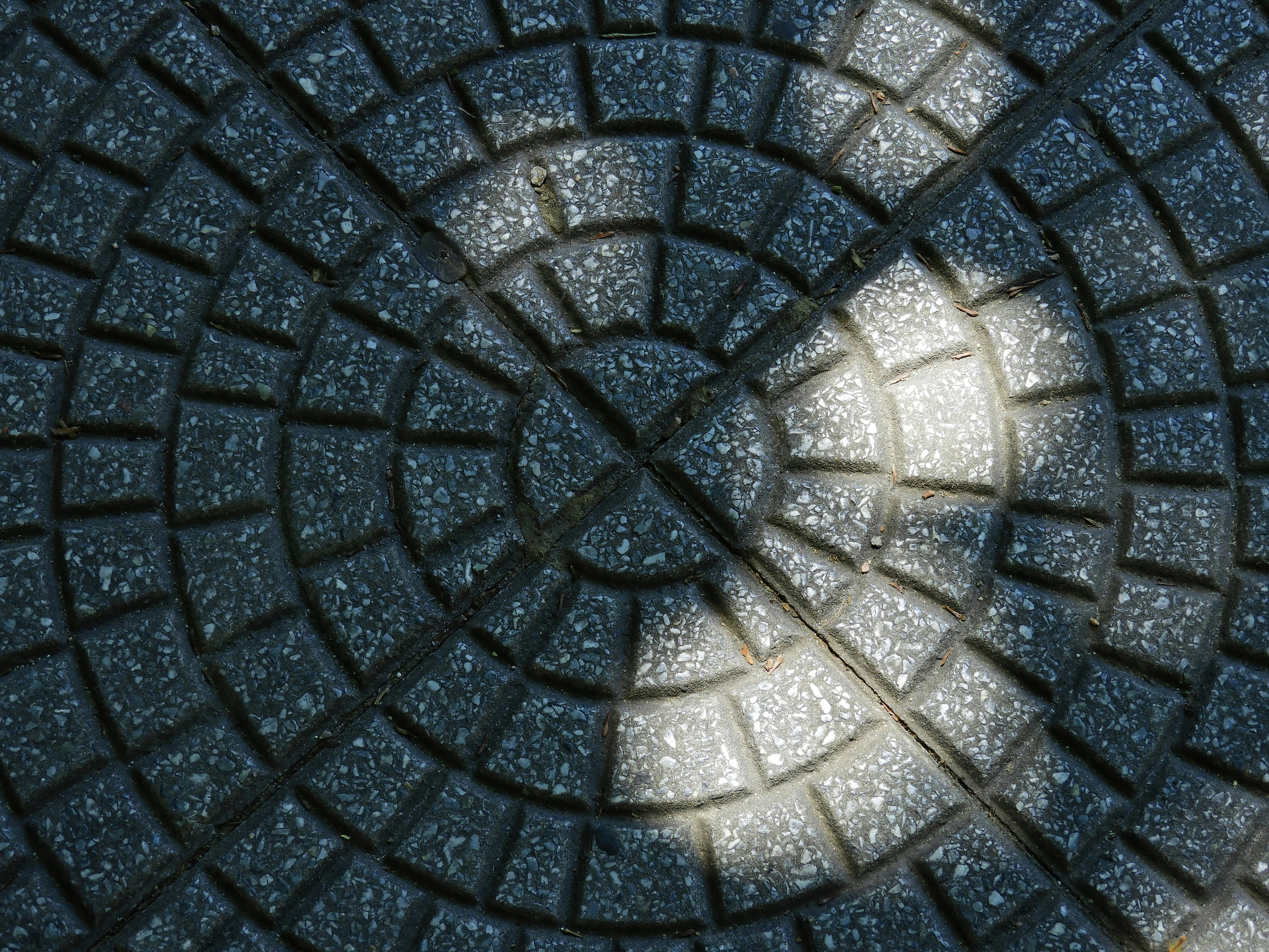 a black and white photo of a circular design