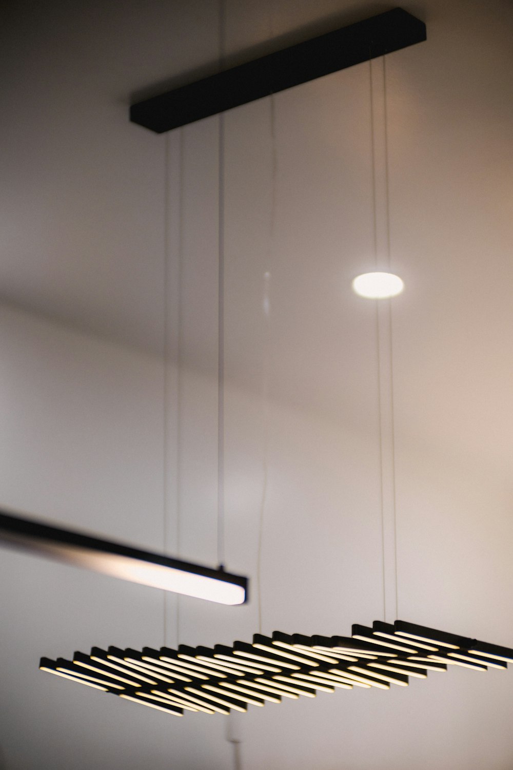 a group of lights hanging from a ceiling