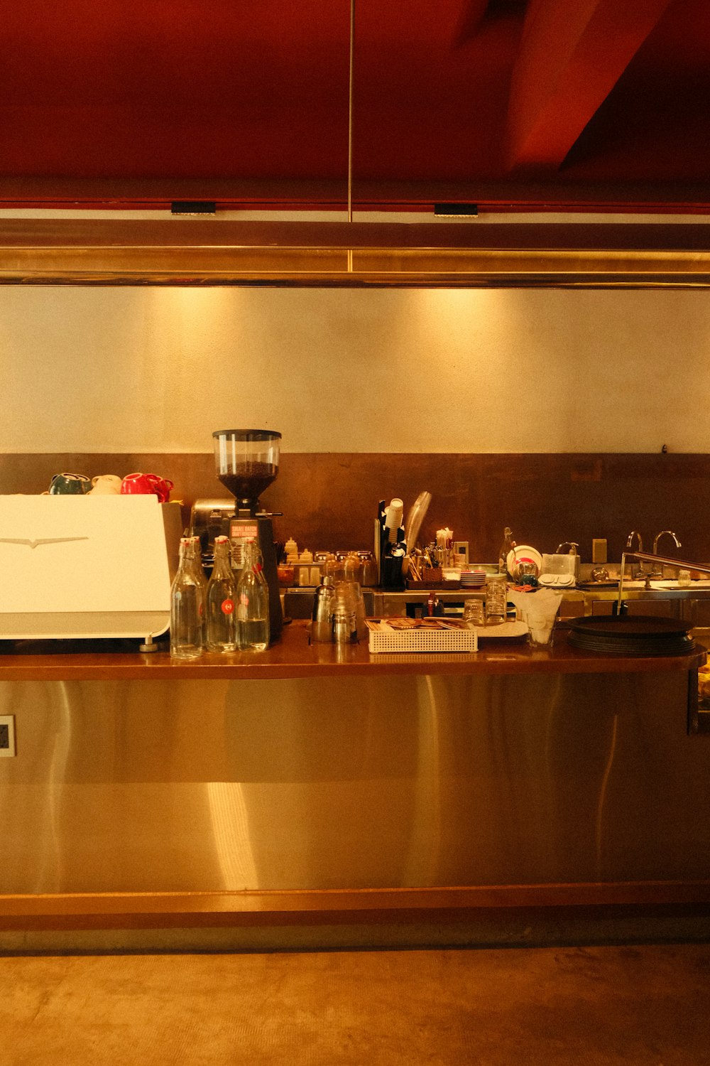 a kitchen counter with a lot of items on it