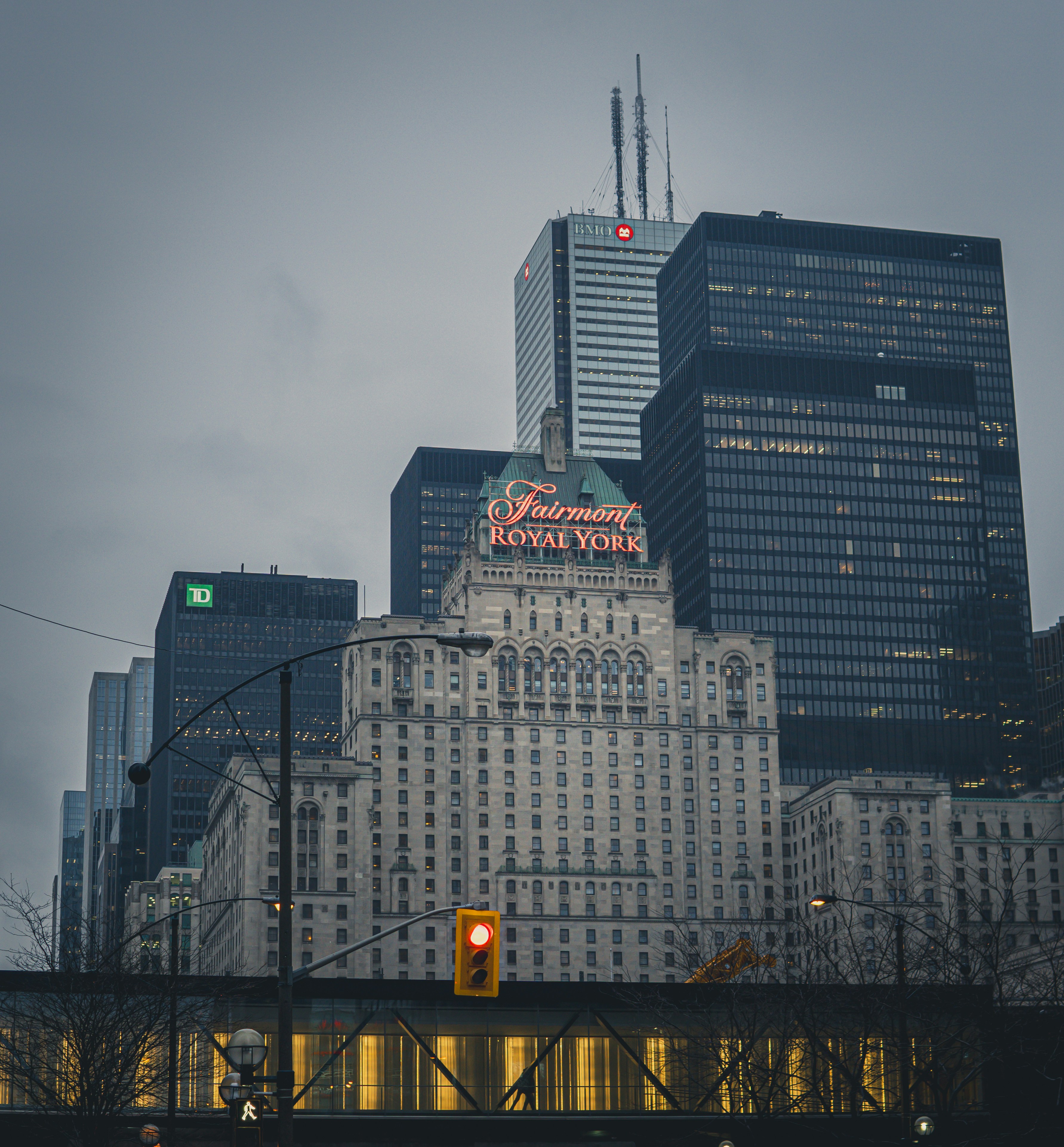 a traffic light in front of a very tall building