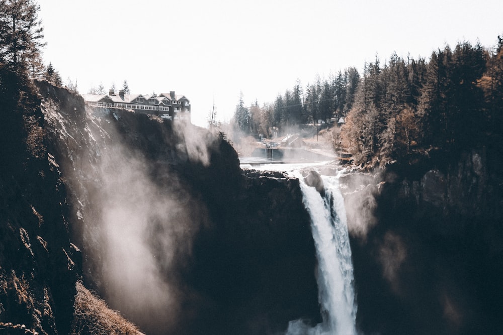 a waterfall in the middle of a forest