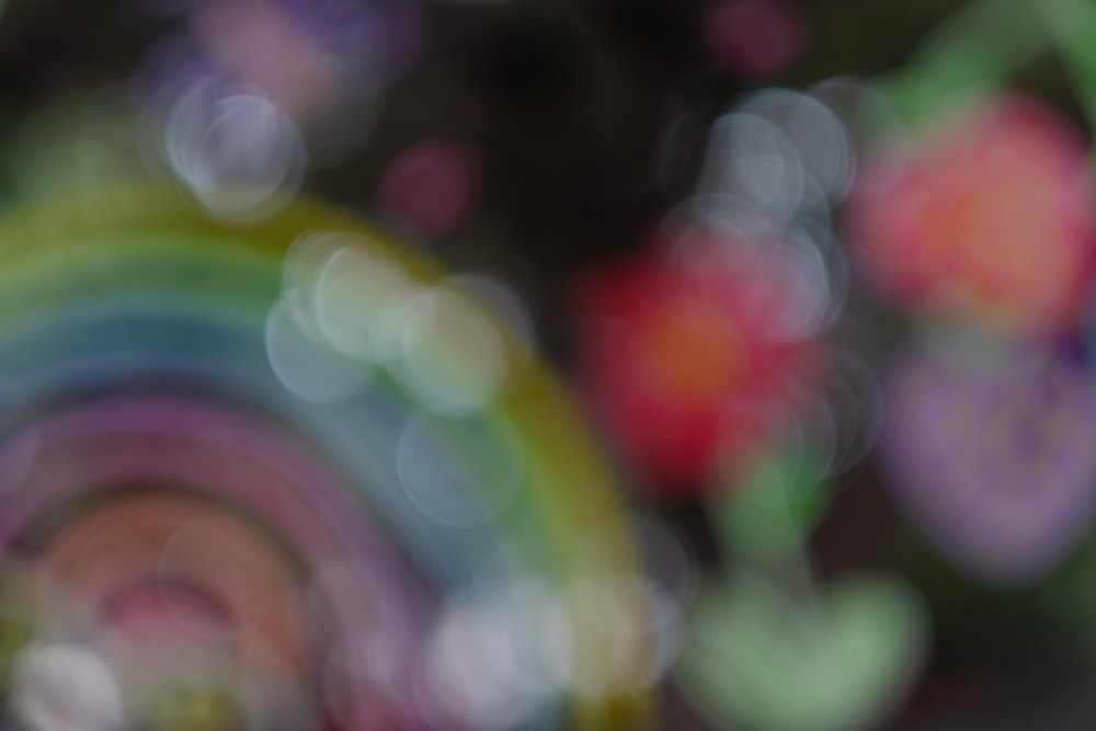 a blurry photo of a rainbow colored object