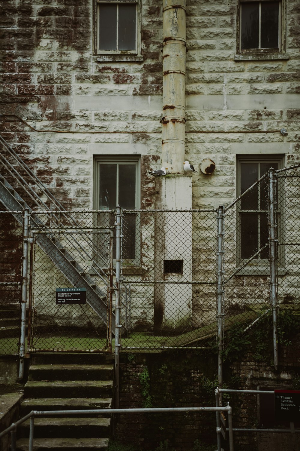 a building with a chain link fence around it