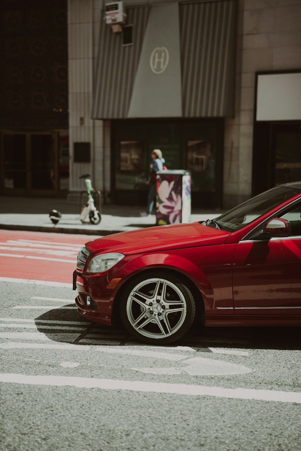 a red car parked on the side of the road