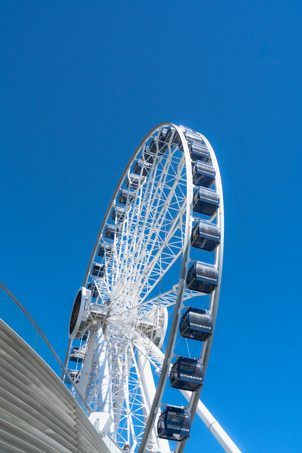a ferris wheel against a clear blue sky