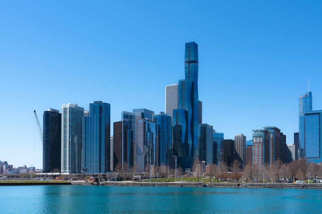 a large body of water with a city in the background,