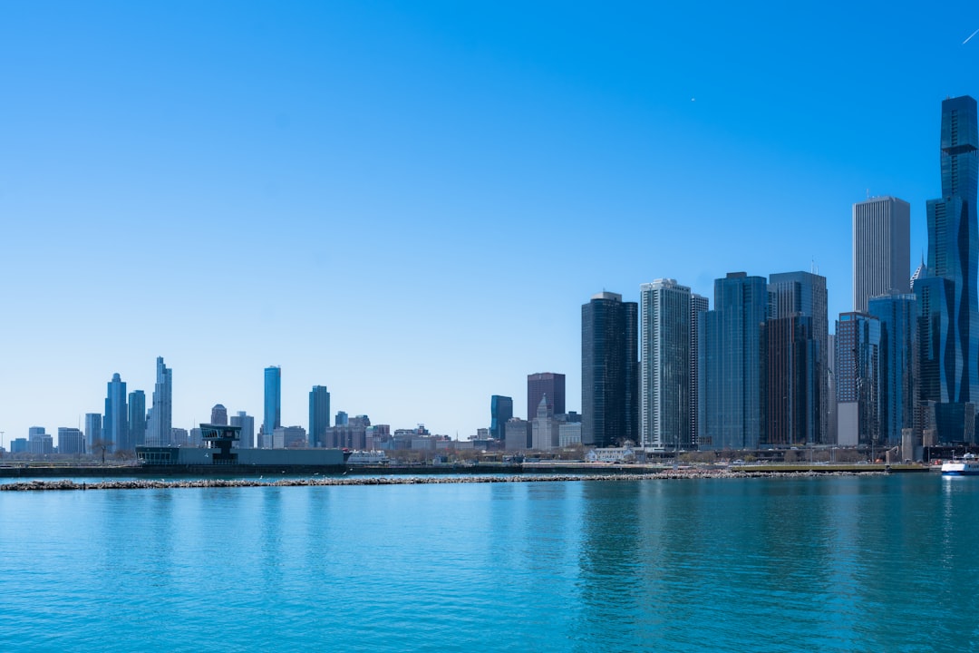 a large body of water with a city in the background,