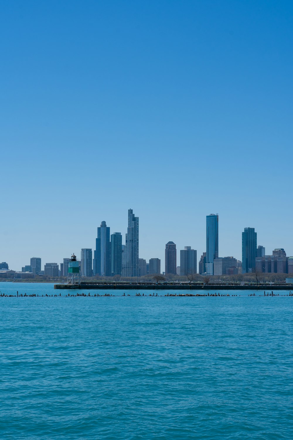 a large body of water with a city in the background