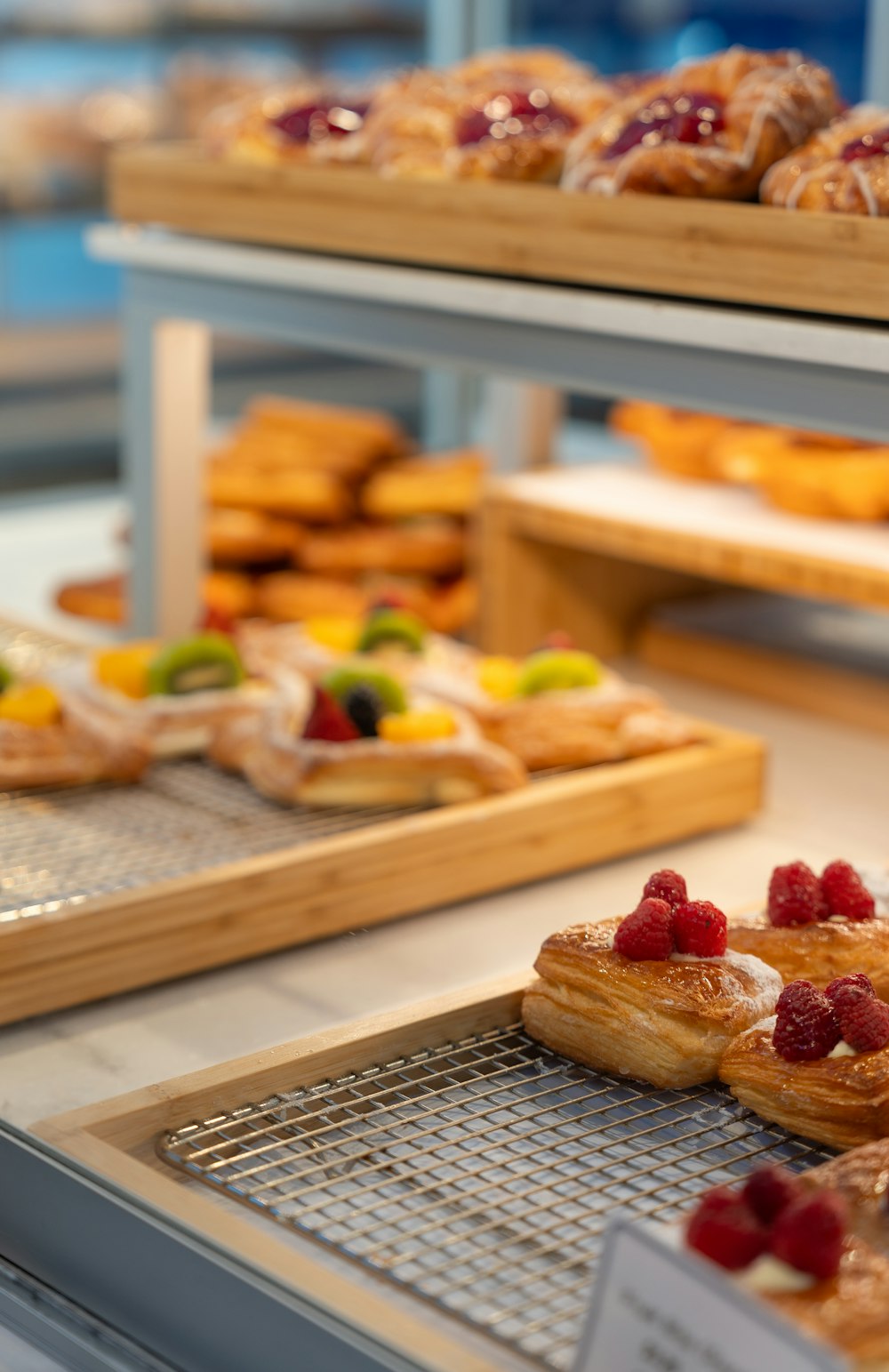 a variety of pastries on display in a bakery