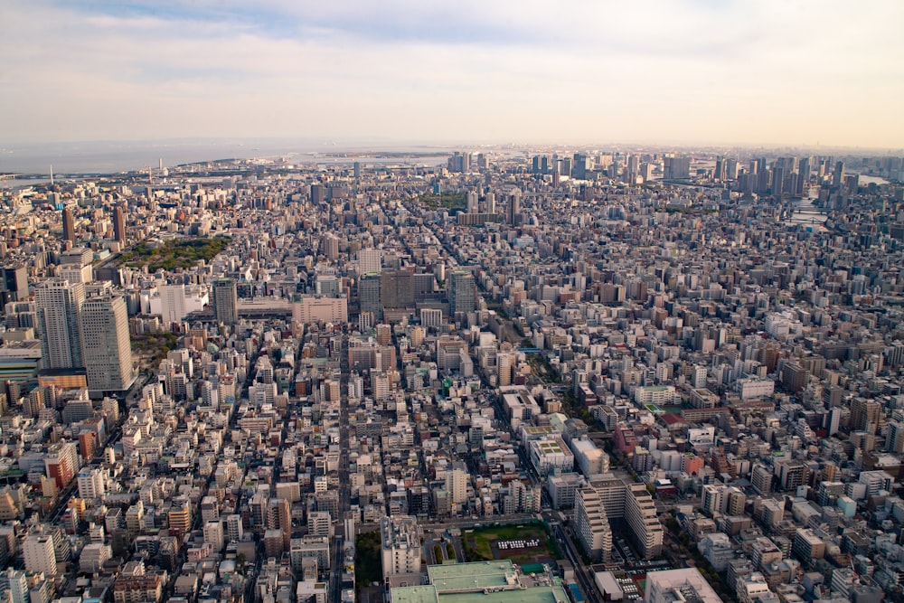 an aerial view of a city with tall buildings