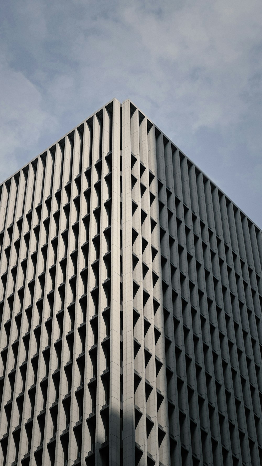 a very tall building with a clock on it's side