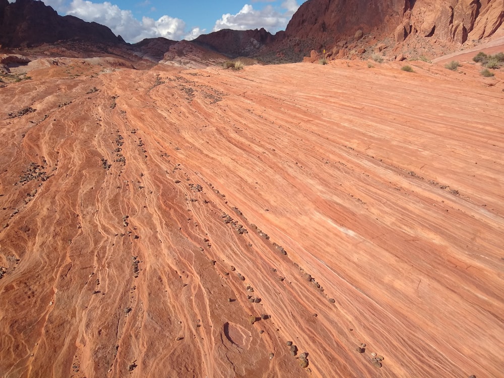 an aerial view of a dirt road in the desert