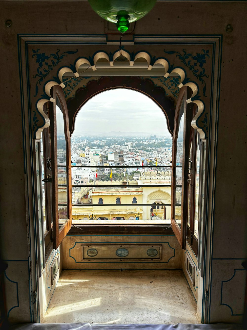 a view of a city from a window in a building