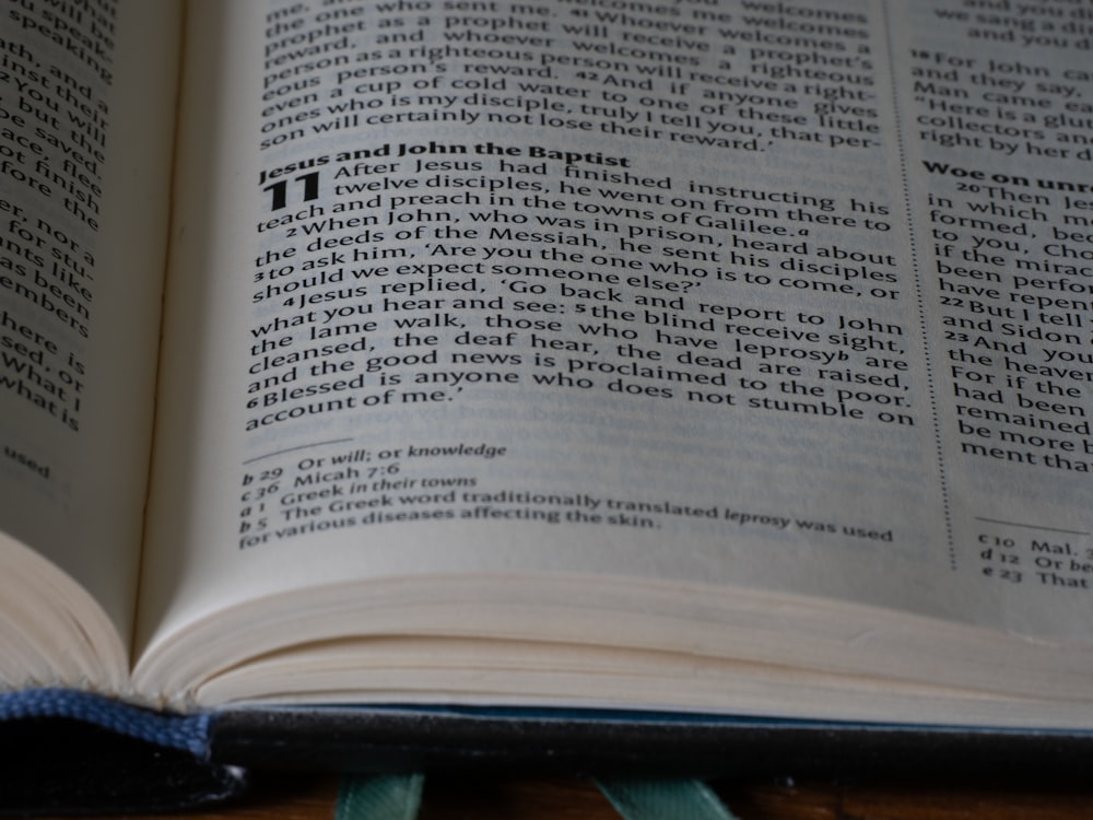 a close up of an open book on a table